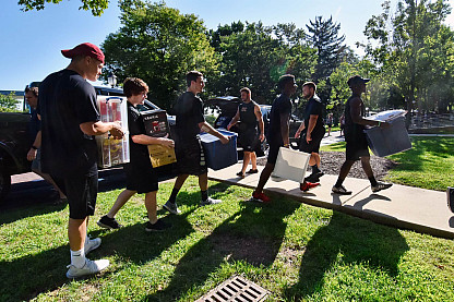 Members of the football team helped with the heavy lifting.