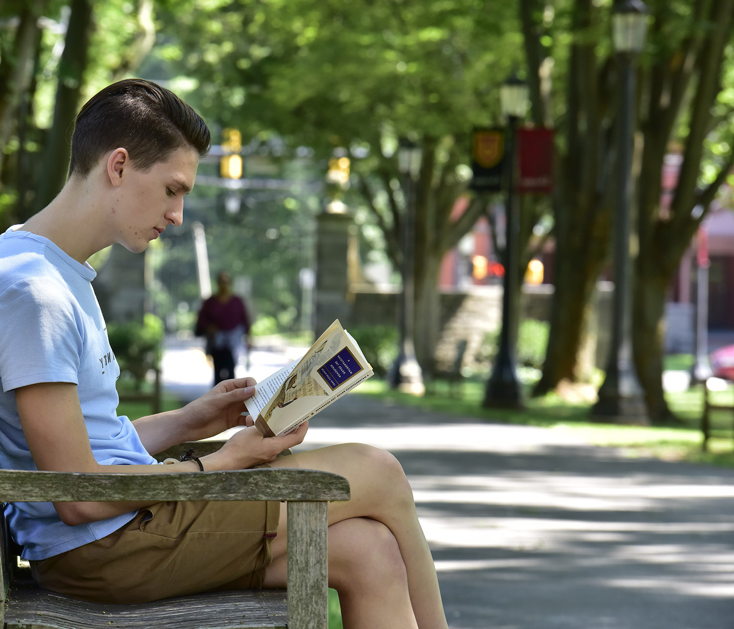 reading student on bench