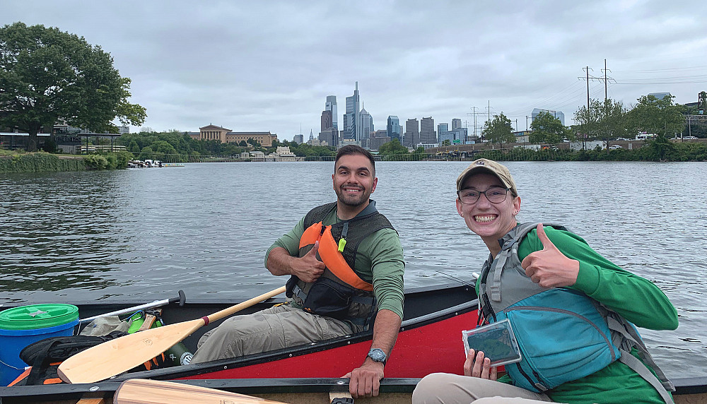 Jeff Cocci '23 (left) and Beth Myers '17 pose in front of the Philadelphia skyline during the ann...