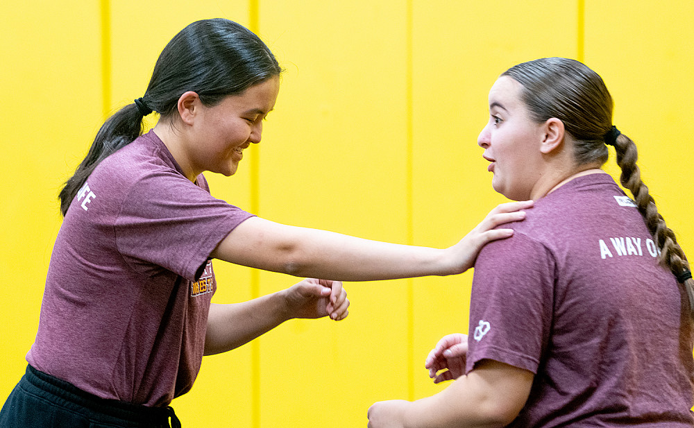 Laura Bradley '25 practices with Calista Kolmer '25.