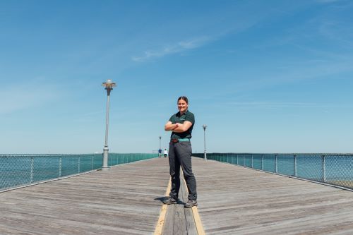 Molly Searfass poses on boardwalk