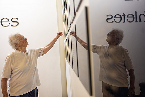 Vonnie Gros peruses the Ursinus Hall of Fame for Athletes.