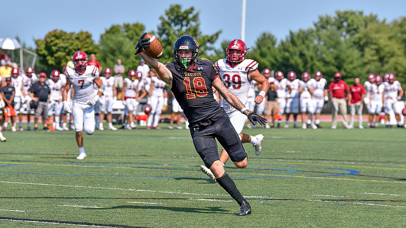 UC player number 19 catching a football