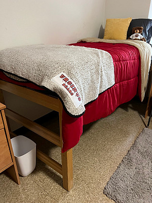 Bed height can go as high as 35"-36" without separate bed risers. To be safe, storage furnishings should be roughly 33-24 max height.