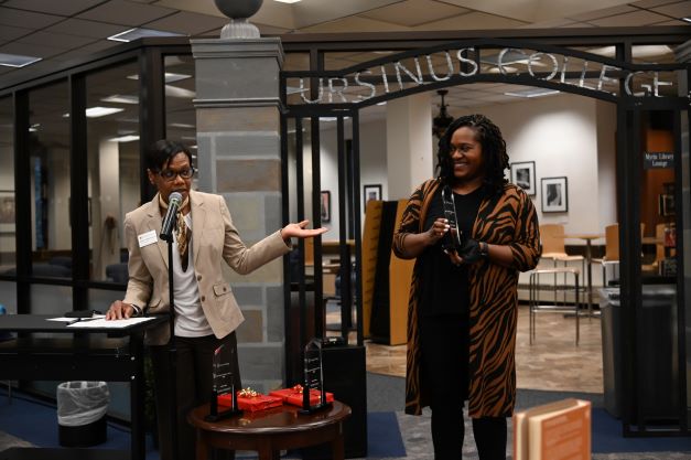 Jennifer King receives the Inclusion and Equity Award from Heather Lobban-Viravong.