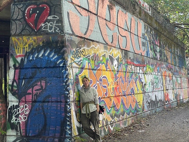 Visiting Instructor of Anthropology Katharine Davis standing at Graffiti Pier in Philadelphia.