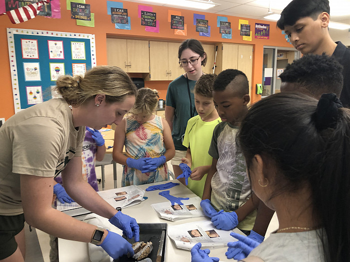 Mya Knappenberger '23 works with campers at Orion Communities