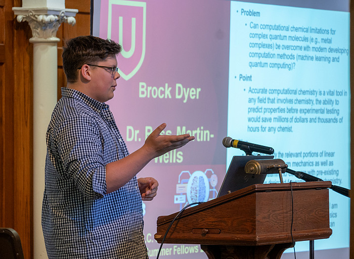 Brock Dyer presents his Summer Fellows research in Bomberger Hall.