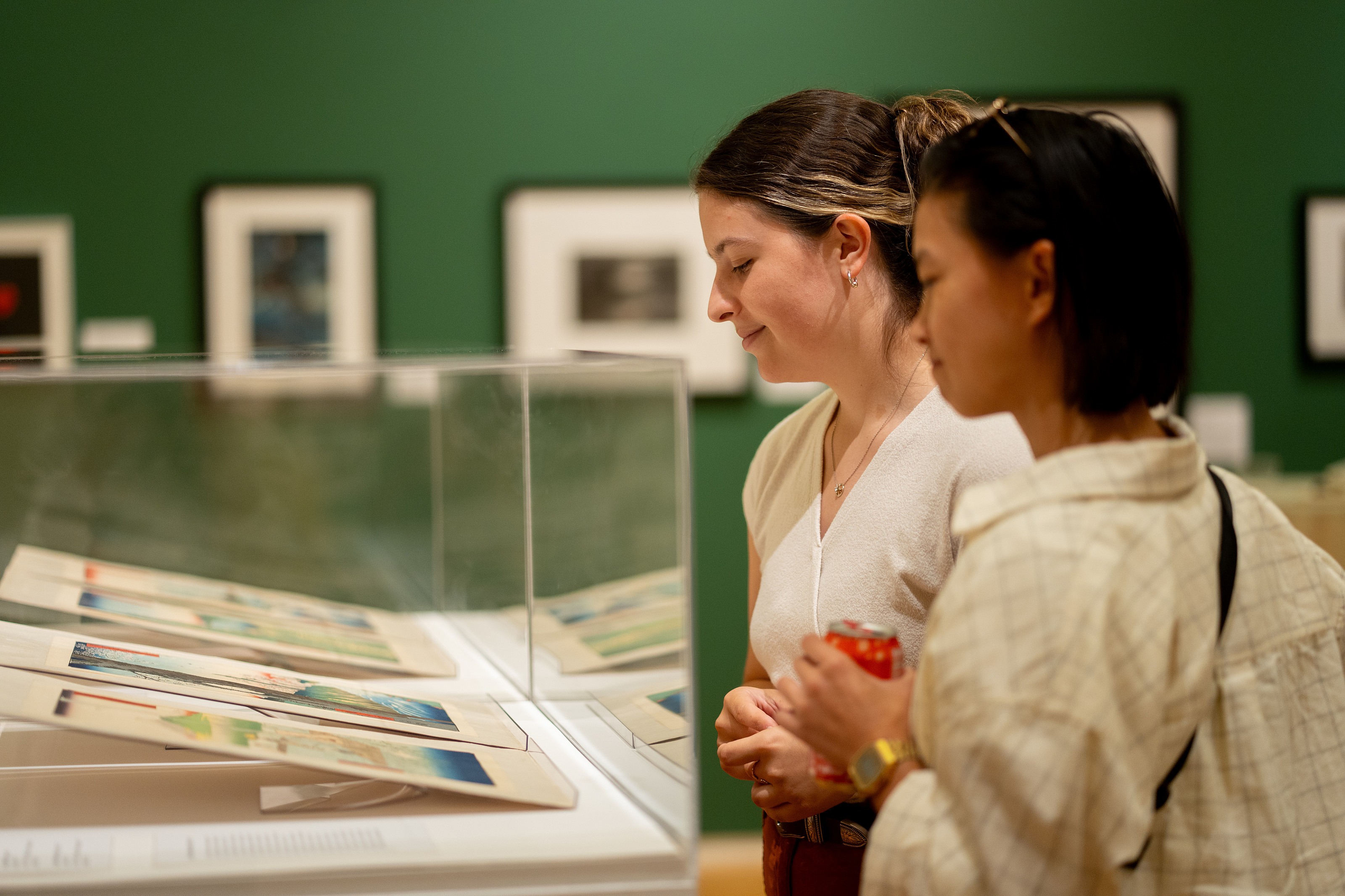 Silhouette of couple looking at art.