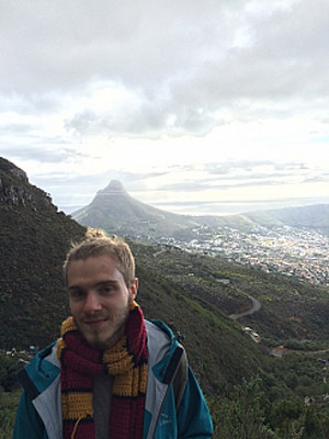 Max Bicking standing in front of a mountain range