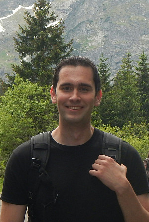 Christopher Sadowski standing in front of a mountain range