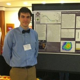 Frank DeVone standing in front of his presentation