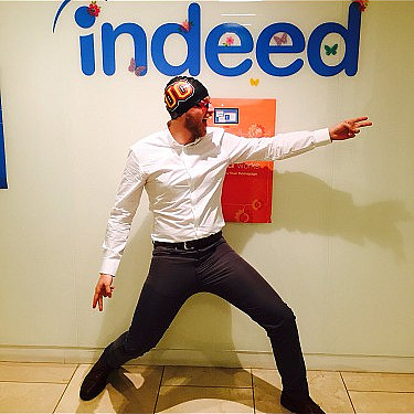 James Marrone posing in front of an Indeed logo