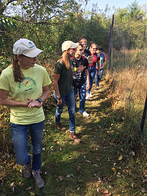 Inspecting the fencing and management of a local reforestation project.