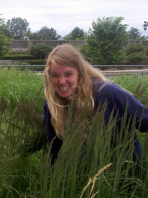 Julia Bull takes a break from presenting her poster.