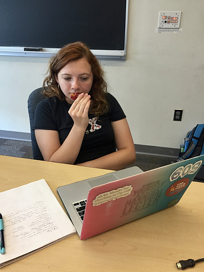 Sam Parrotta tentatively tastes a Kousa dogwood berry harvested from outside of Pfahler Hall in t...