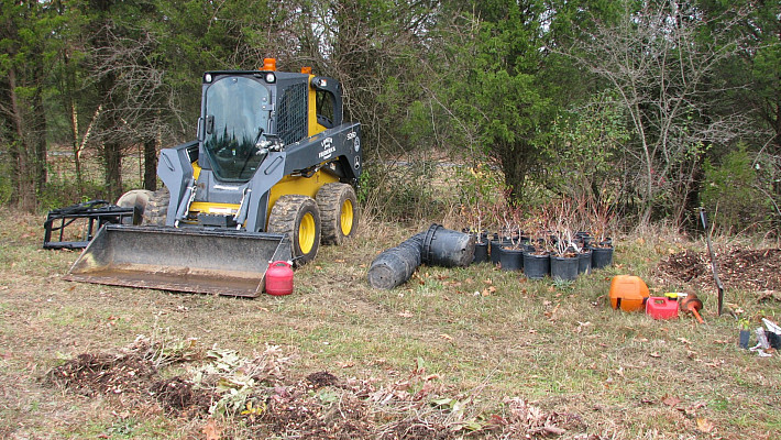 Heavy equipment and some container plants.