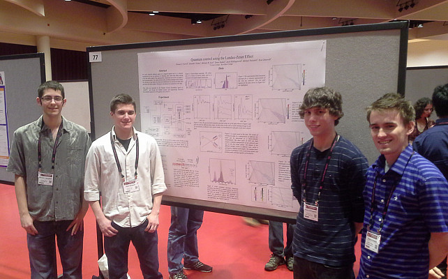 Mike Vennettilli, Jake Hollingsworth, Tamas Budner, and Ryan Zmiewski presenting their research at DAMOP 2015 in Madison, WI.