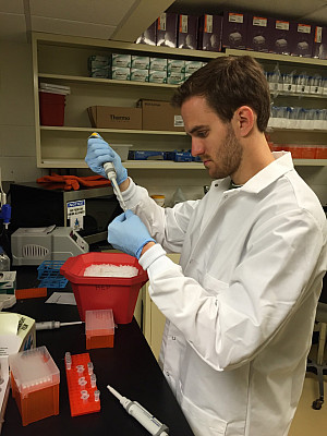 Skylar McCornick demonstrating pipetting techniques to ensure accurate volumetric measurements