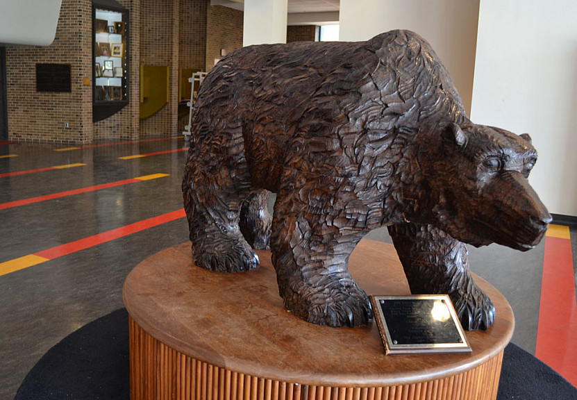 This bear statue, which sits in the lobby of Helfferich Gym, was carved from the original sycamor...