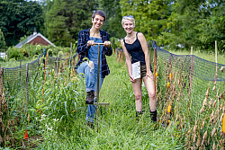 Ursinus students Madison Moses (left) and Jess Greenburg work on the Ursinus farm.