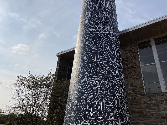 The Ursinus smokestack, transformed into a mural by Brooklyn artist Katie Merz.