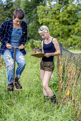 Madi Moses taking soil samples for her research