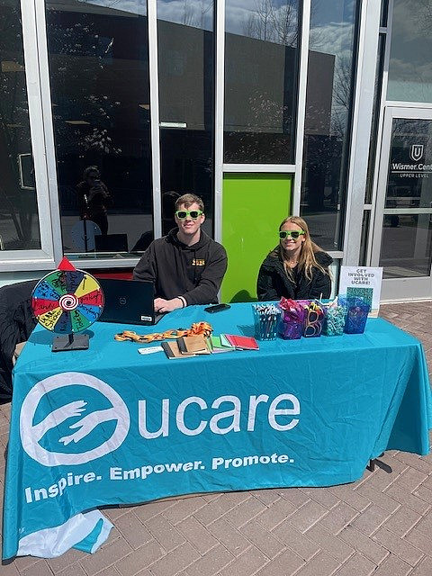 Photo of UCARE Fellows Cole Grubbs '25 & Kate Rubinkam '26 kicking off Spring voter registration