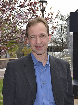 Headshot of John Spencer